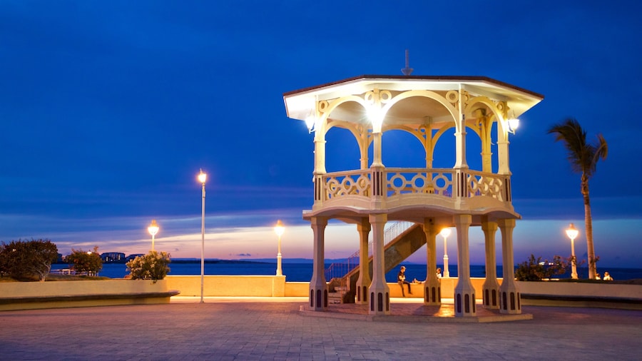 Malecon Kiosk which includes night scenes and general coastal views
