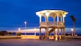 Malecon Kiosk which includes night scenes and general coastal views