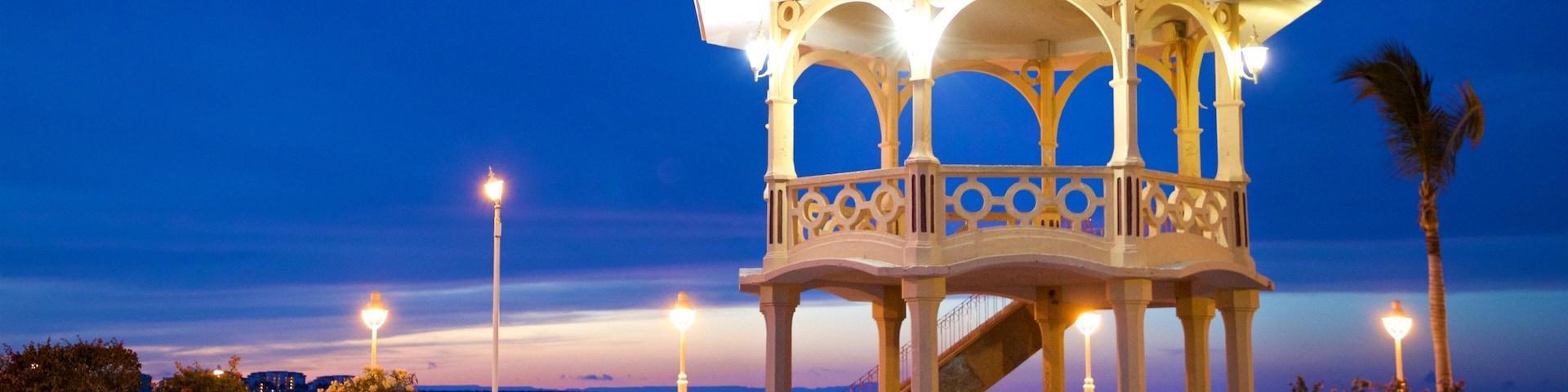 Malecon Kiosk which includes night scenes and general coastal views