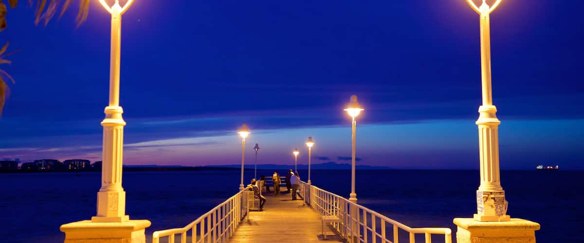 Malecon Kiosk featuring night scenes
