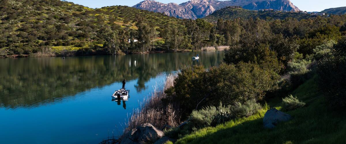 People fish from boats at Lake Jennings in Lakeside, California located in San Diego County also a popular destination for hiking, camping and picnicking.