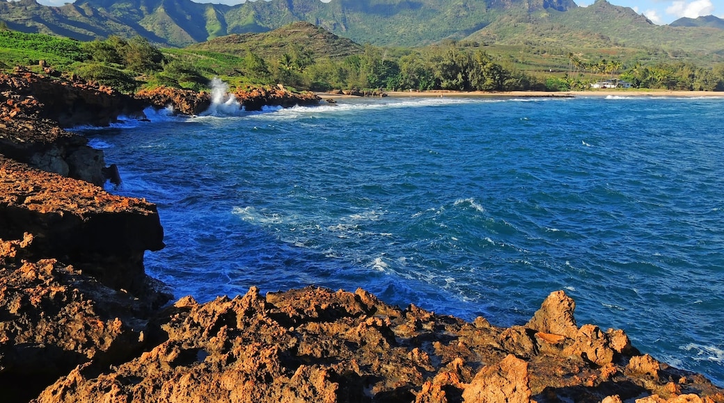 Spectacularly-eroded coastline and surf at shipwreck beach along the mahaulepu heritage trail in poipu, kauai, Hawaii