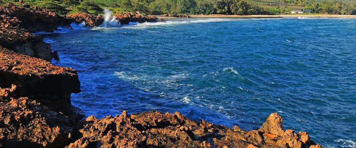 Spectacularly-eroded coastline and surf at  shipwreck  beach along the mahaulepu heritage trail in poipu, kauai, Hawaii