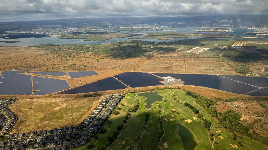 Aerial view of Hawaiian island of Oahu with Hawaii Prince Golf Club, solar engery fields and the towns of Waipahu and Pearl City in the background