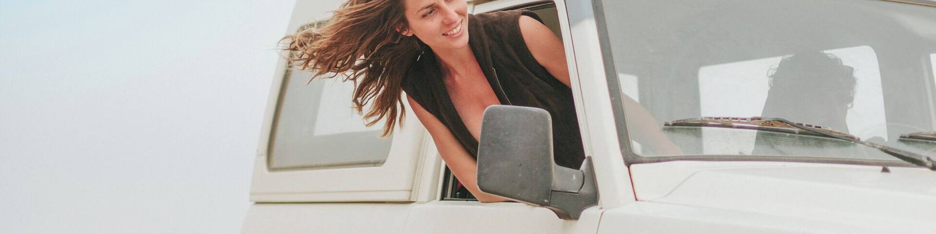 Couple in Adventure with Car in the Middle of the Desert Area