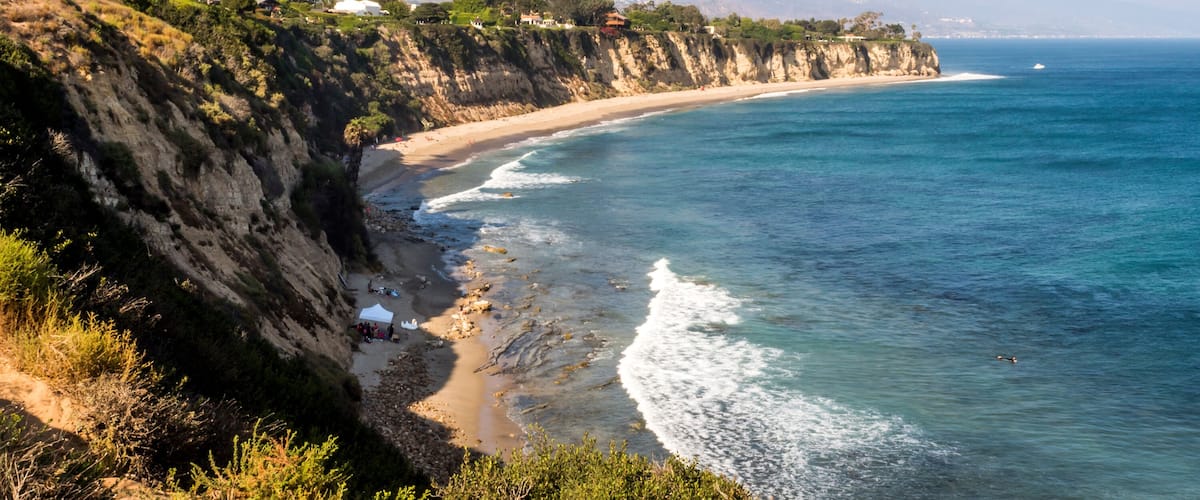 Paradise Cove Malibu, Zuma Beach, emerald and blue water in a quite paradise beach surrounded by cliffs. Malibu, Los Angeles, LA, California, CA, USA