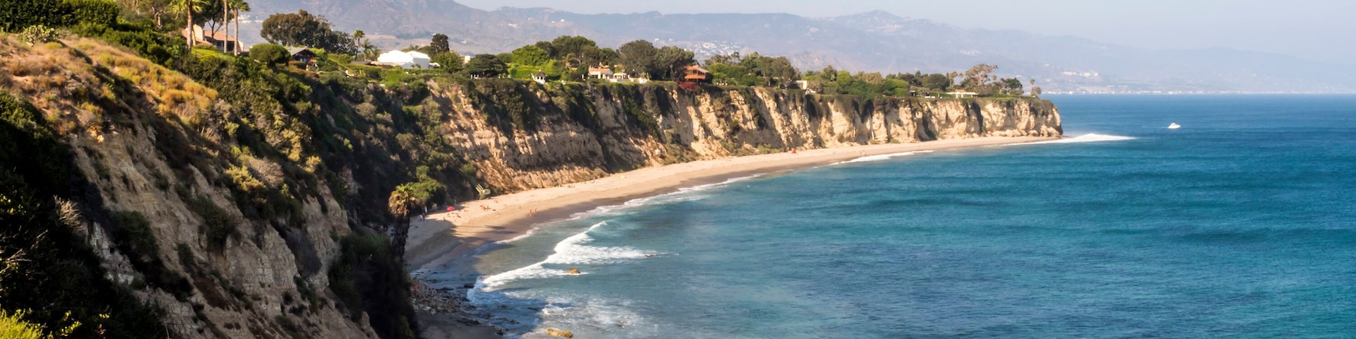 Paradise Cove Malibu, Zuma Beach, emerald and blue water in a quite paradise beach surrounded by cliffs. Malibu, Los Angeles, LA, California, CA, USA