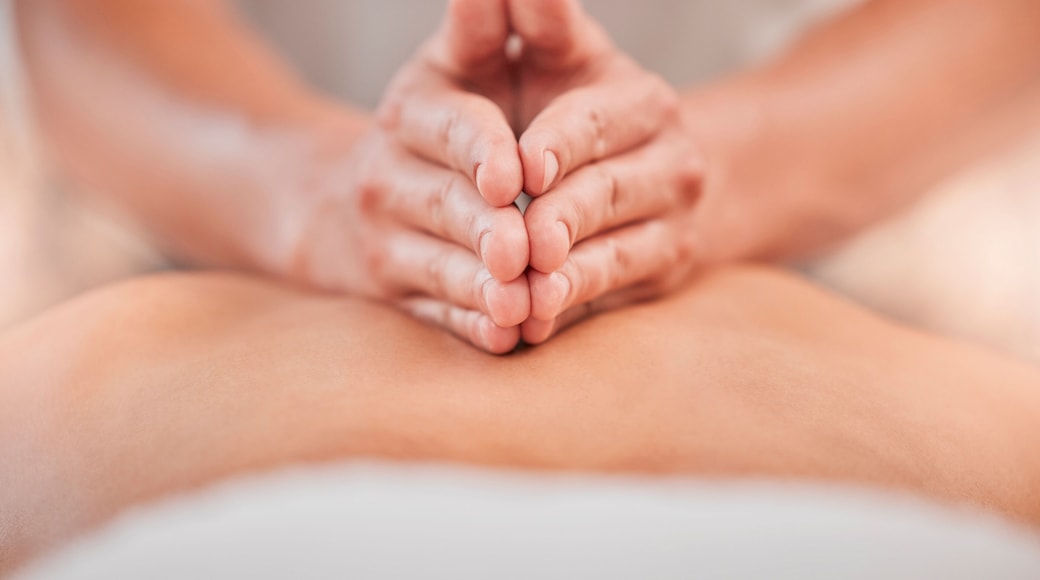 Back massage, hand and spa for a massage therapist for zen body care and beauty, health or wellness. Massueuse, physical therapy and stress relief with tranquil treatment for relaxation and wellbeing