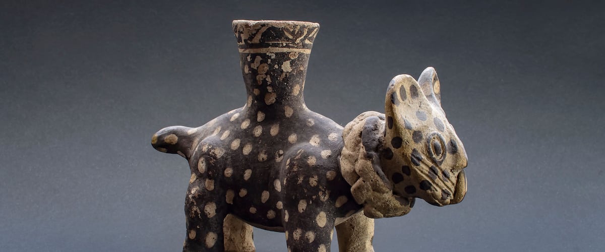 Pre-columbian feline pottery called "Huaco" from Chancay, an ancient Peruvian culture. Pre inca handcrafted pottery piece made by this ancient civilization.