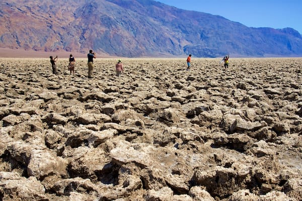 Death Valley featuring tranquil scenes and desert views as well as a small group of people