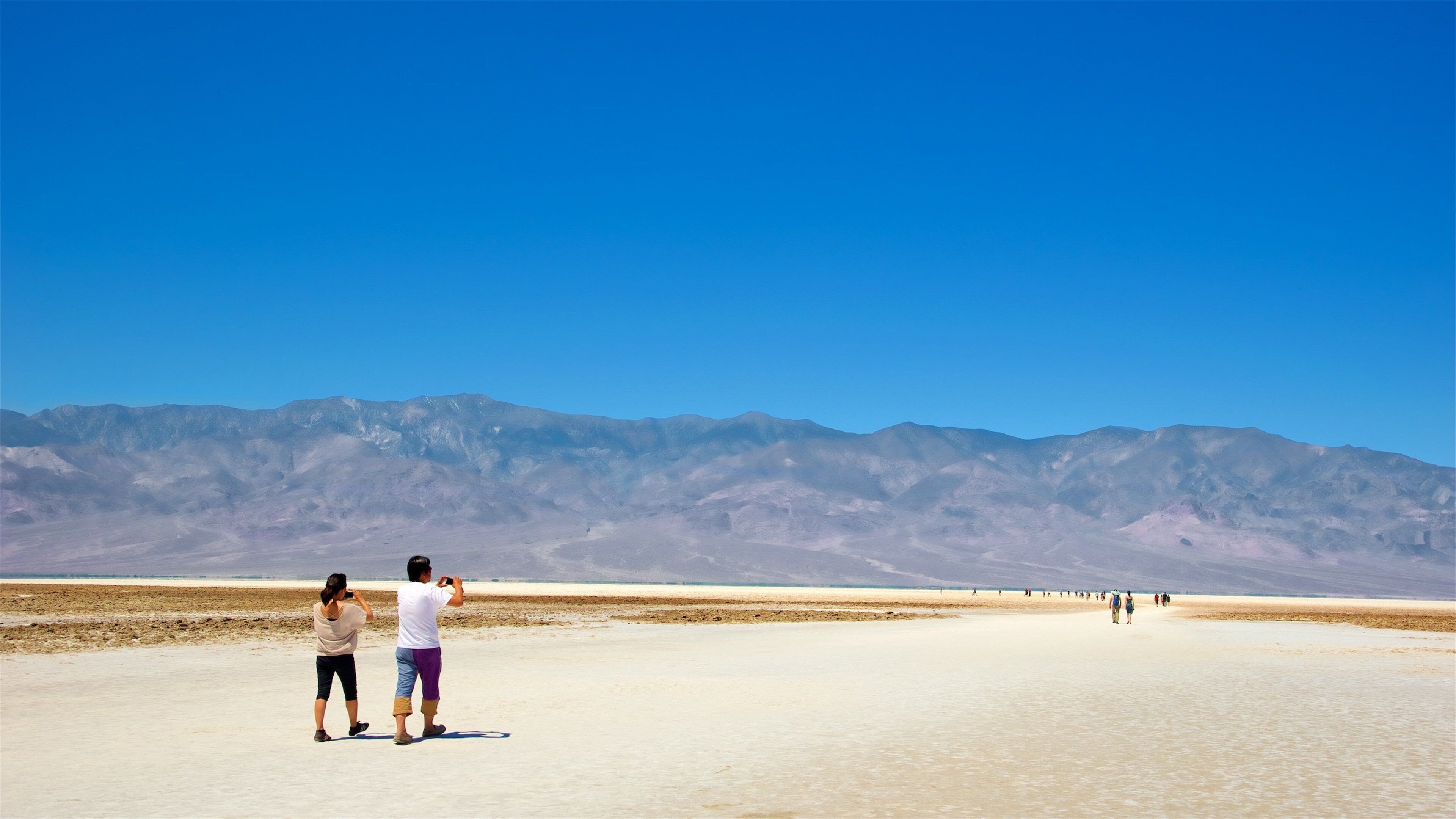 Death Valley National Park showing desert views and landscape views as well as a couple