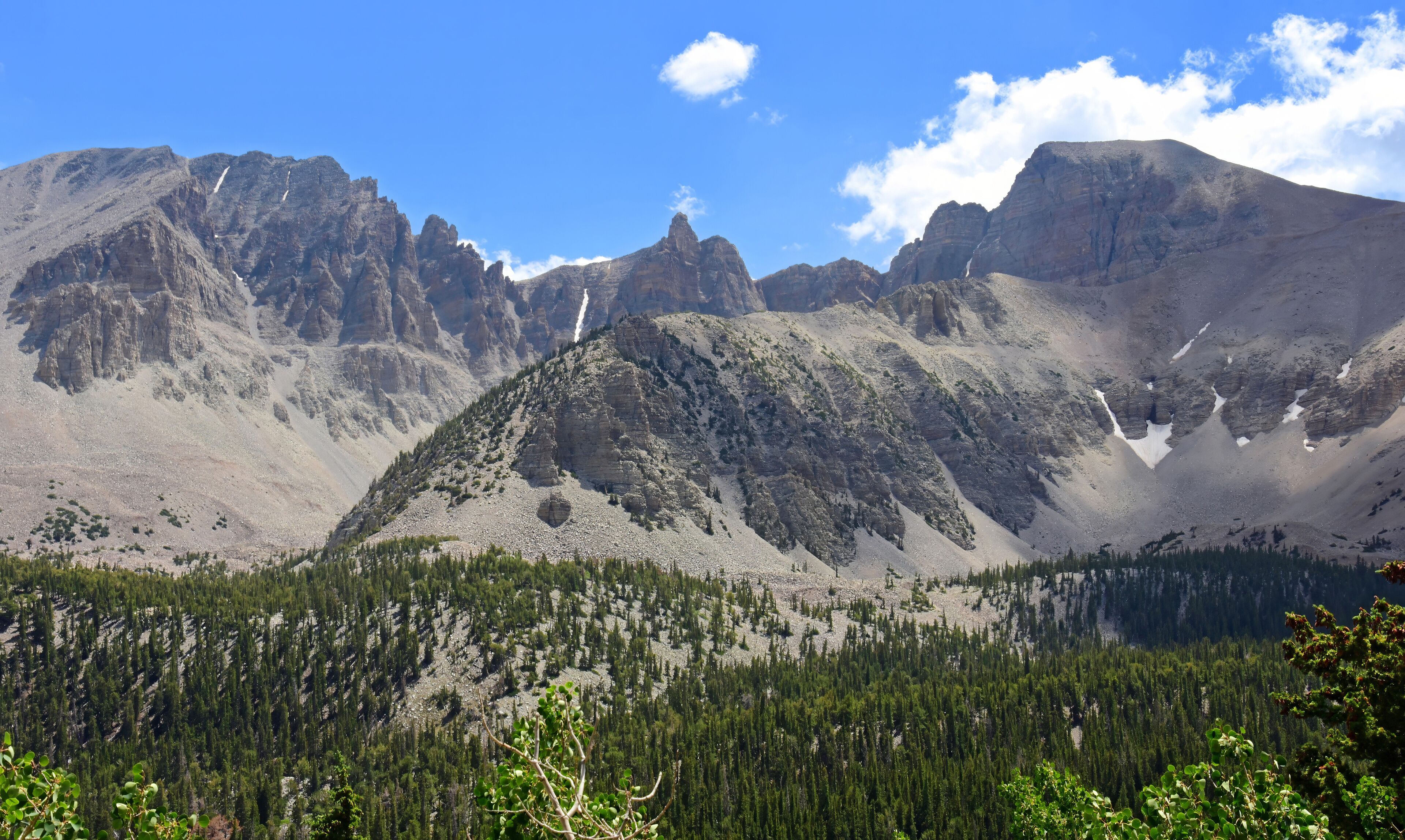 picturesque  wheeler peak, pyramid peak, and jeff davis peak on a sunny  summer day  along the alpine lakes loop trail in great basin national park near baker, nevada
