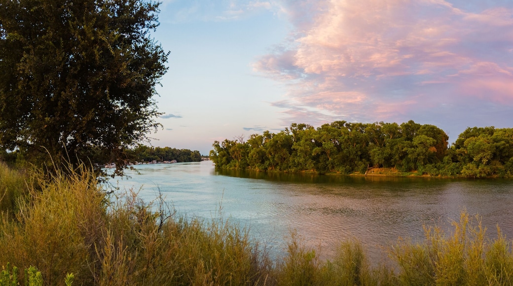 Panoramic landscape view of Sacramento river near pocket area at sunset