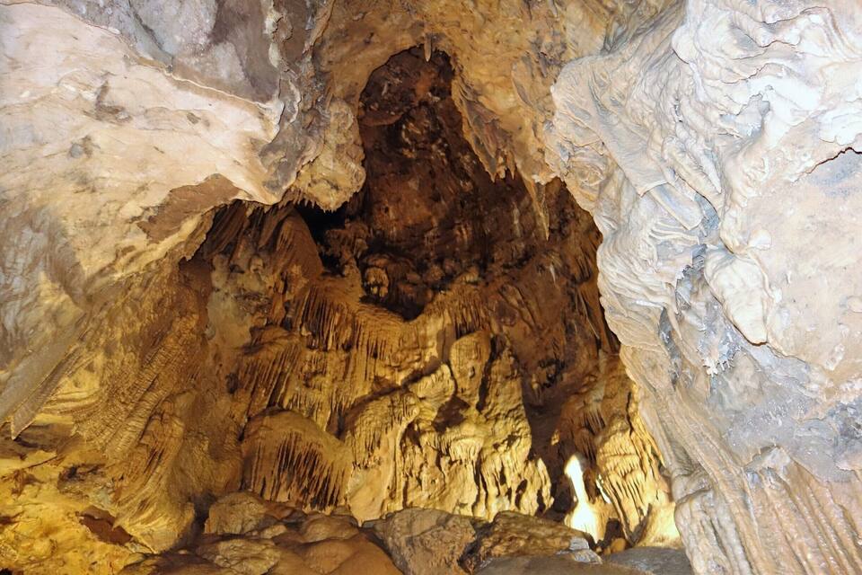 A cave with stalactites and stalagmites.