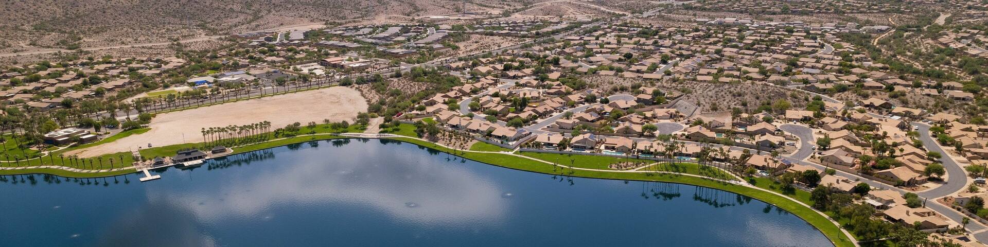 Aerial view of North Lake and Goodyear, Arizona cityscape with mountains in the background