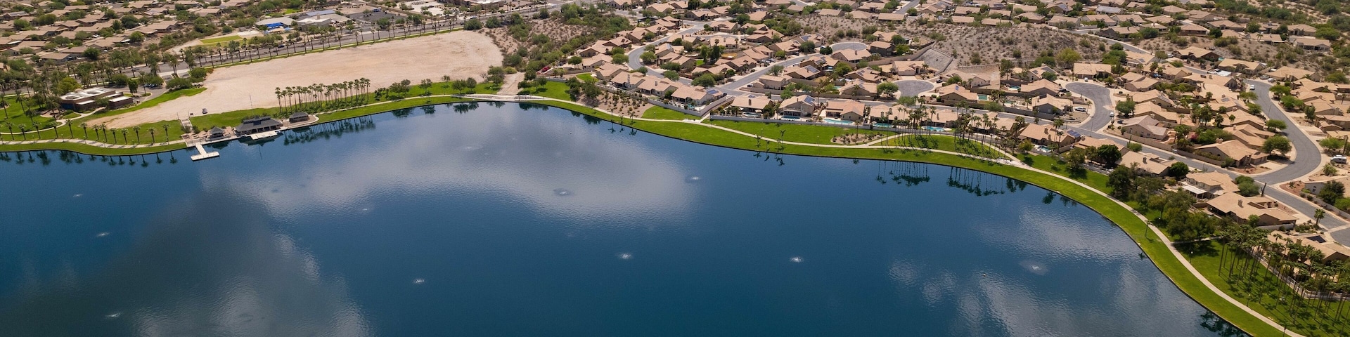 Aerial view of North Lake and Goodyear, Arizona cityscape with mountains in the background