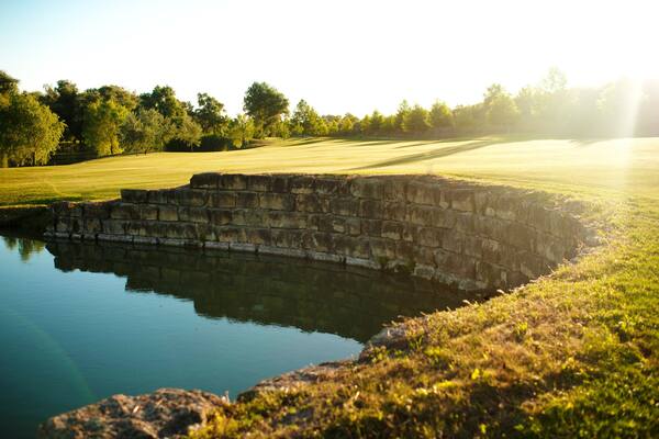 Beautiful pond, bounded with stone wall