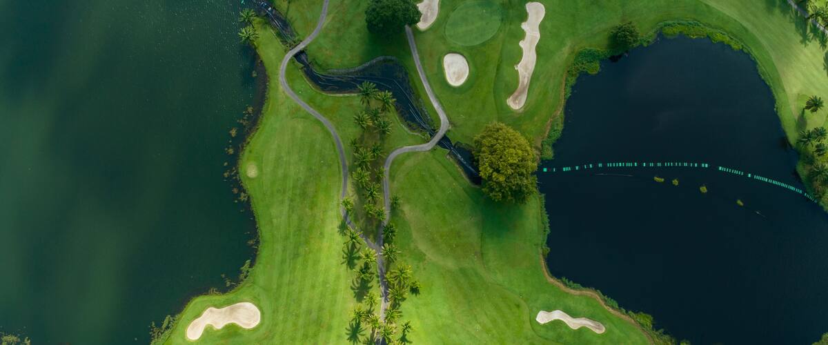 Aerial view of beautiful green golf field fairway and putting green,Top view image for sport background and travel nature background, Amazing green nature view