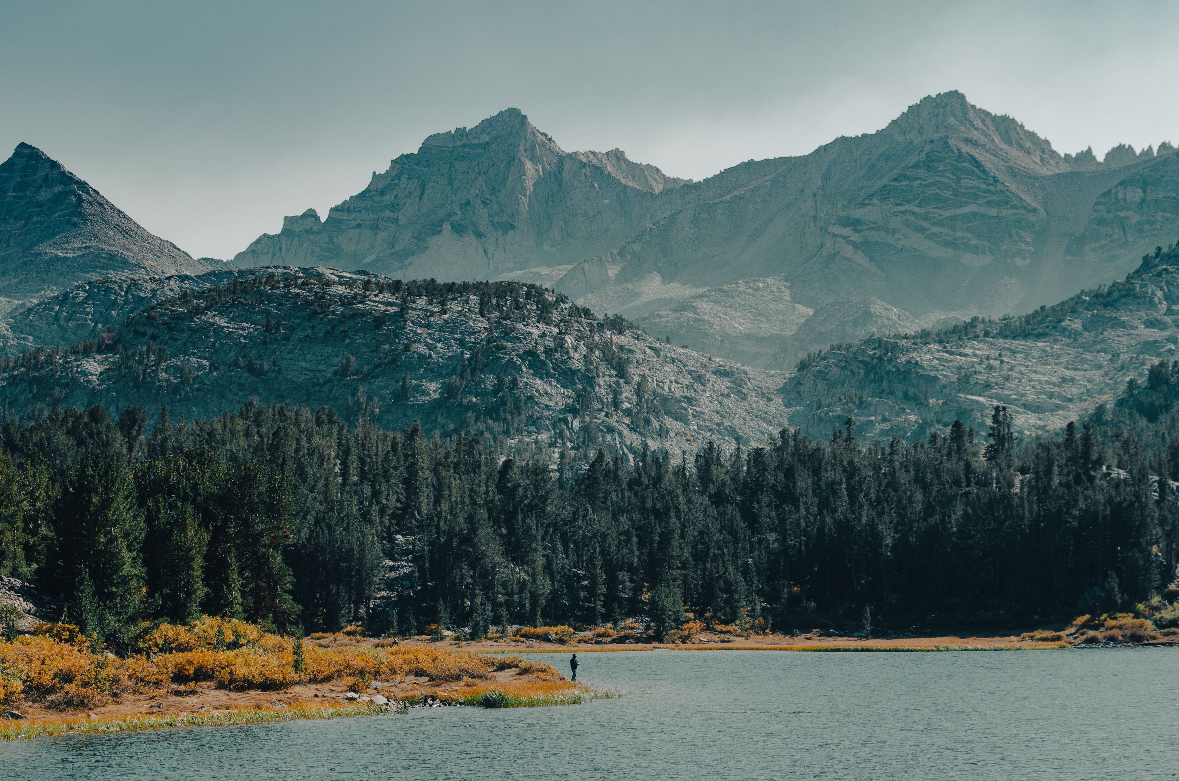 Man Fishing in Long Lake. Little Lakes Valley Trail in Bishop California