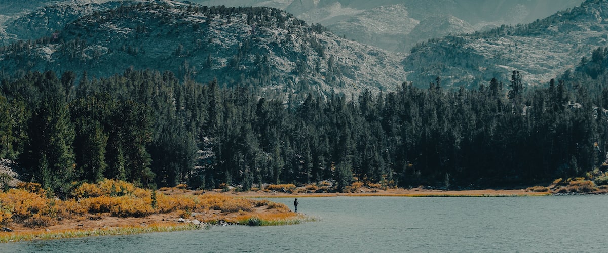 Man Fishing in Long Lake. Little Lakes Valley Trail in Bishop California