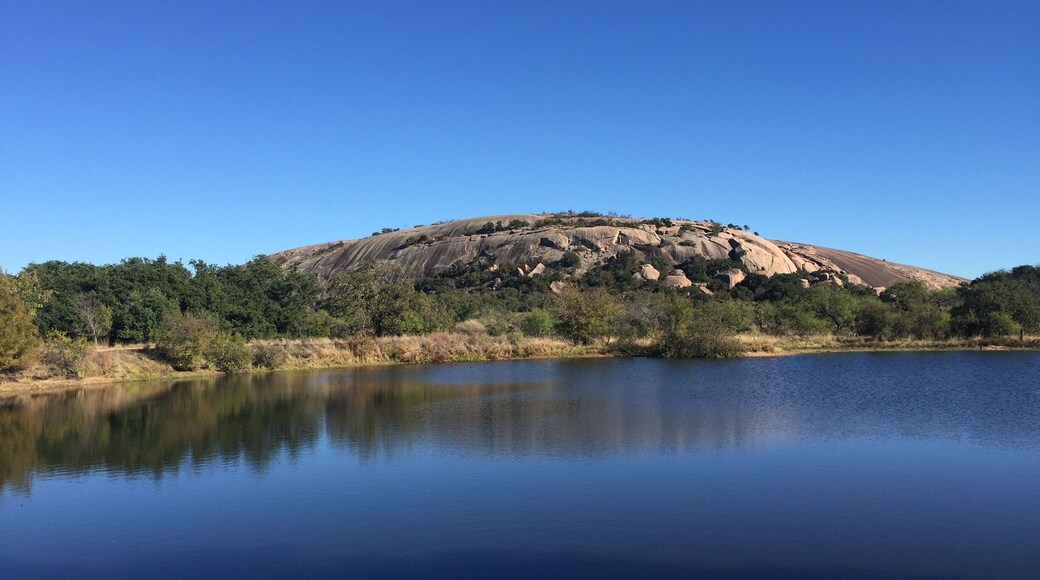 View of the west side of Enchanted Rock across Moss Lake. This state natural area offers spectacular hiking opportunities.