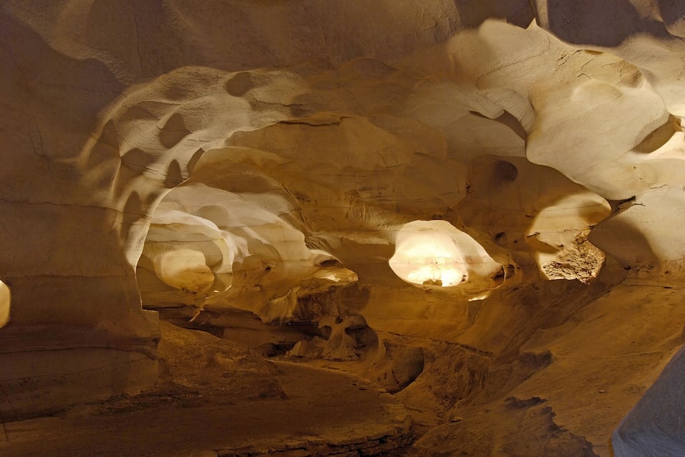 An underground cave with stalactites and stalagmites.