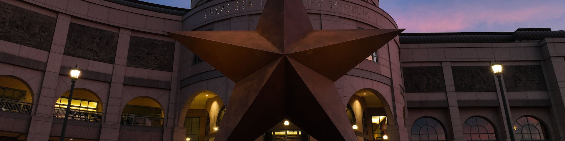 Colorful sky over the star at the Texas State History Museum in austin, Texas USA