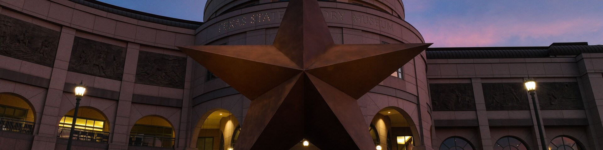 Colorful sky over the star at the Texas State History Museum in austin, Texas USA