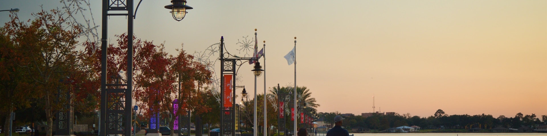 Bord Du Lac Park which includes general coastal views and a sunset as well as a couple