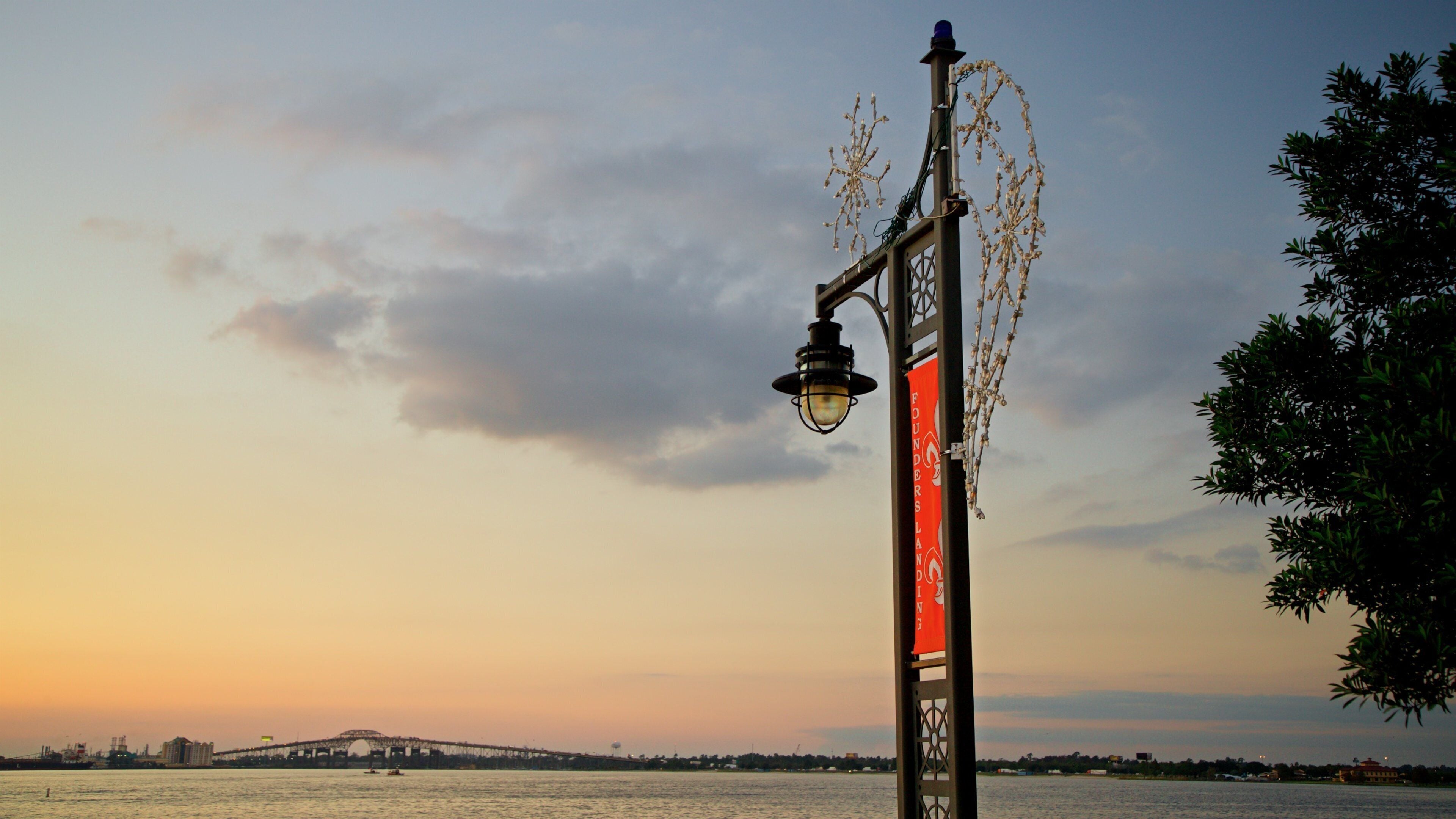 Bord Du Lac Park featuring general coastal views and a sunset