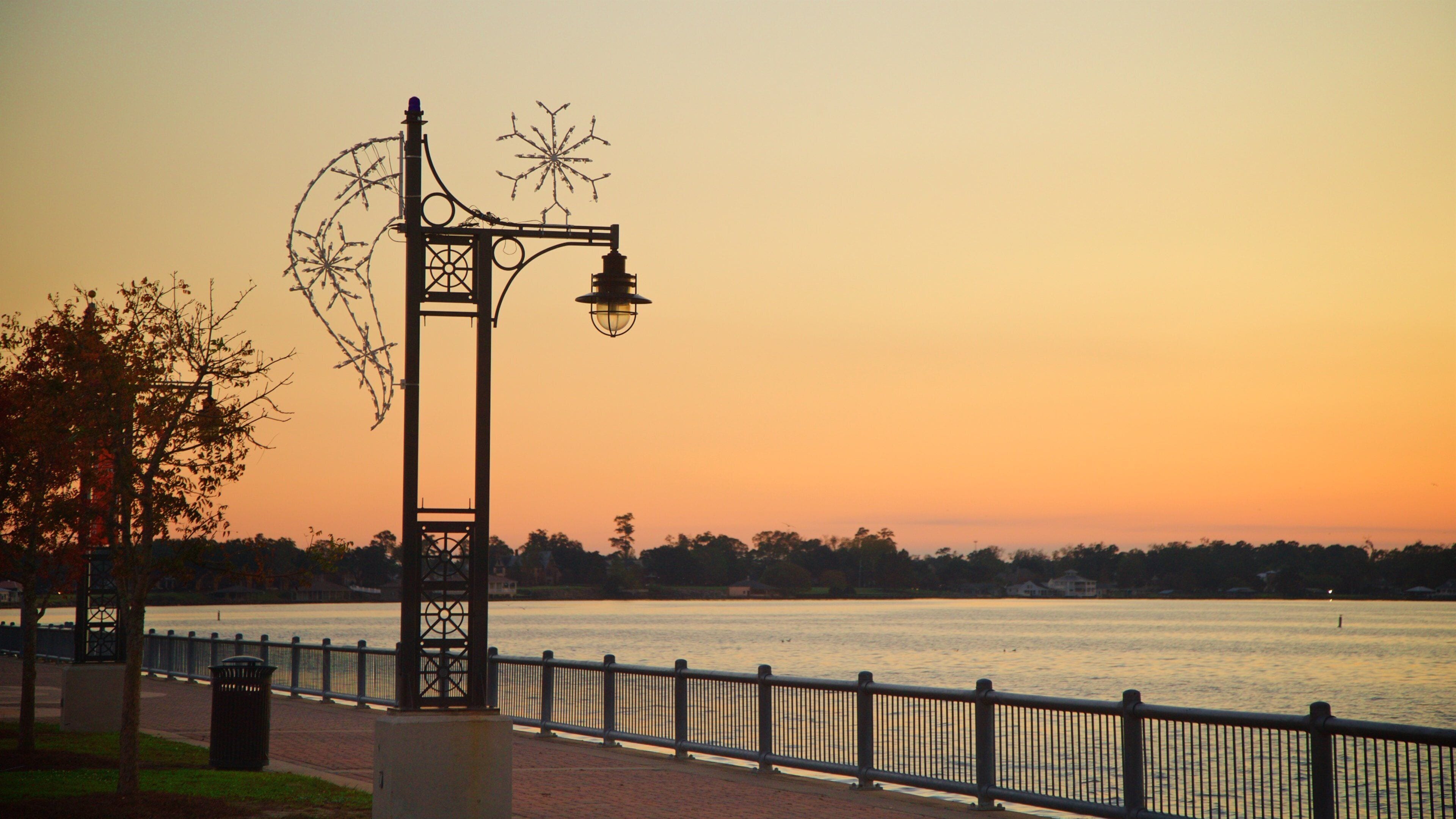 Bord Du Lac Park featuring a sunset and general coastal views