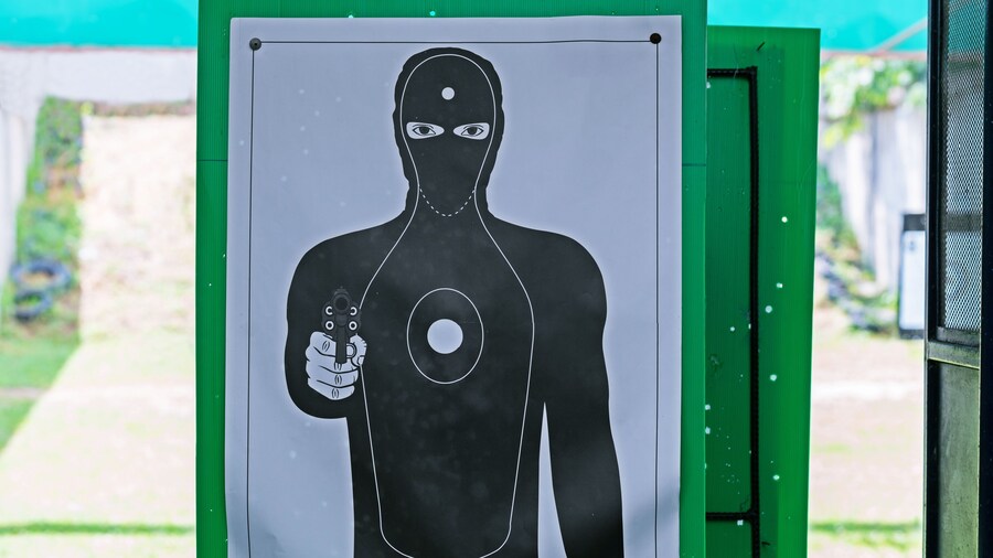 Target black silhouette of man.
best for practicing aiming.
THE Black human holding handgun shooting target.