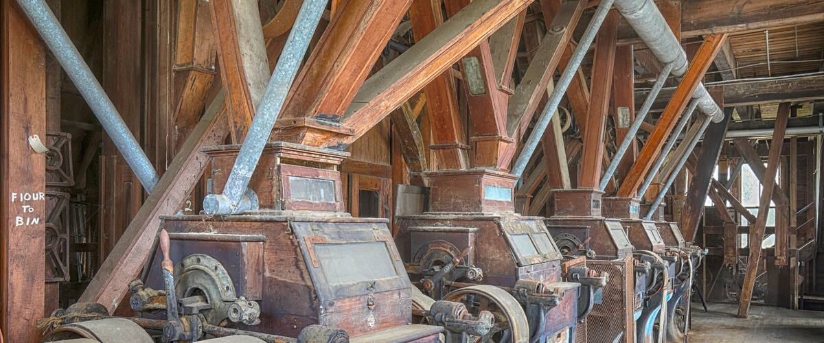 Wooden grist mill equipment in abandoned factory