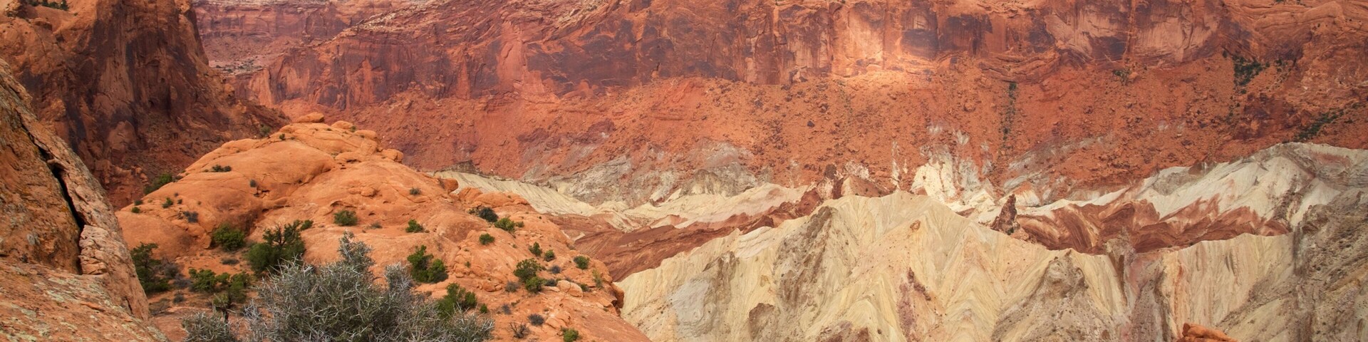 Upheaval Dome which includes mountains, landscape views and a gorge or canyon