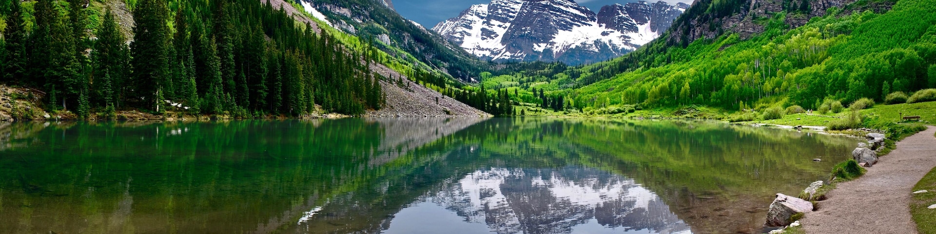 Maroon Bells reflections in calm clear water of Maroon Lake near Aspen. Colorado. United States of America