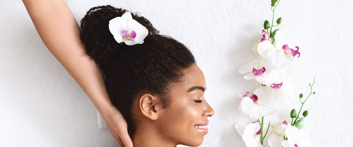 Beautiful african girl enjoying day at new spa