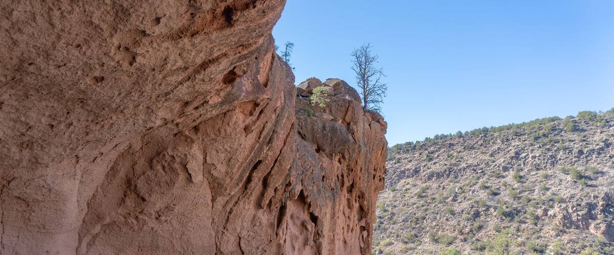 Alcove House at Bandelier National Monument preserves Ancestral Puebloan home in New Mexico. Ceremonial Cave with kiva above Frijoles Canyon.