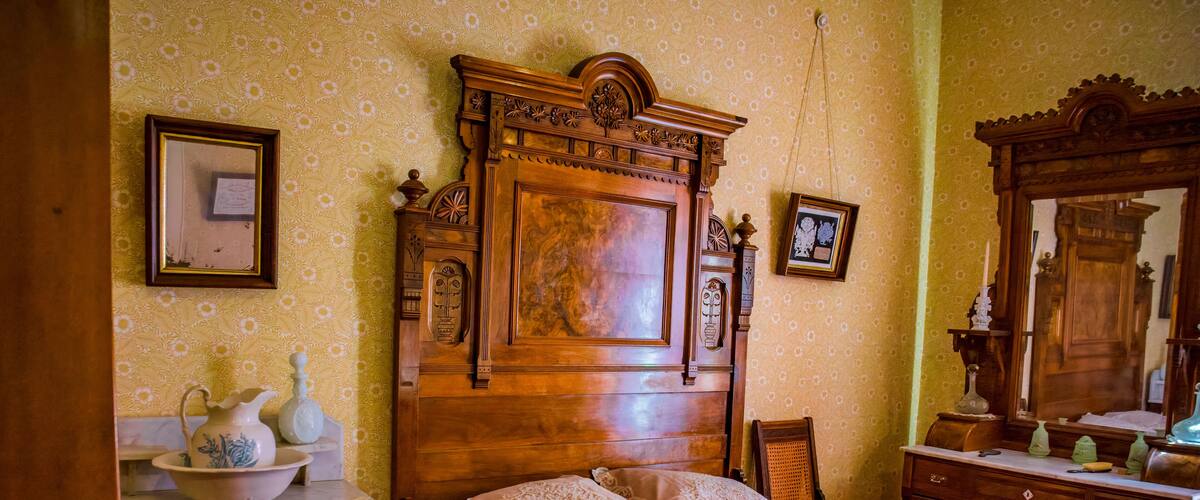 Bedroom in a restored old pioneer home