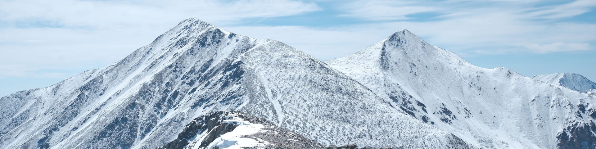 Panorama of Torreys mountain summit in the foreground and Grays mountain summit in the background on the right