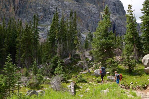 Sky Pond showing hiking or walking and forest scenes as well as a couple