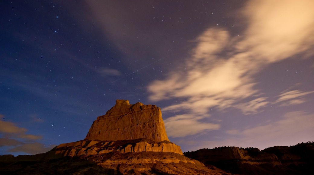 Scotts Bluff National Monument which includes a sunset, mountains and tranquil scenes