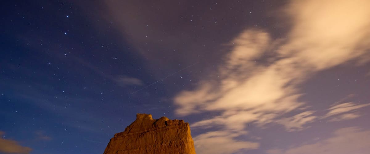 Scotts Bluff National Monument which includes a sunset, mountains and tranquil scenes