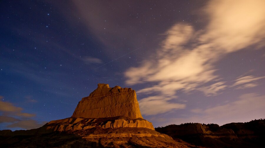 Scotts Bluff National Monument which includes a sunset, mountains and tranquil scenes