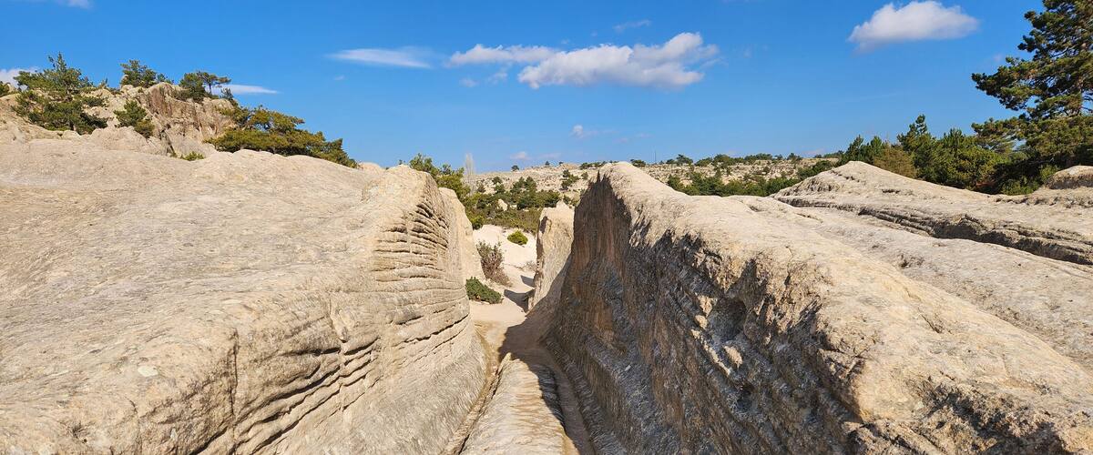 The King's Road in the ancient Phrygian Valley is a historic path linking major Phrygian cities, adorned with rock carvings and monuments, reflecting rich cultural heritage.