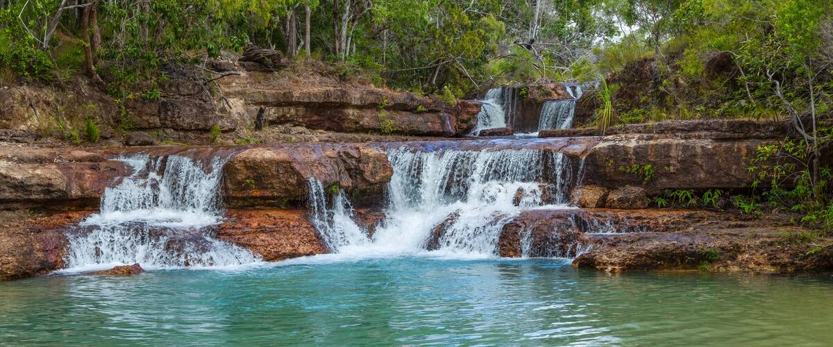 Fruit Bat Falls, a popular set of waterfalls and swimming holes because of a lack of crocodiles, situated on the Telegraph Track in Jardine River National Park on Cape York in Queensland, Australia.