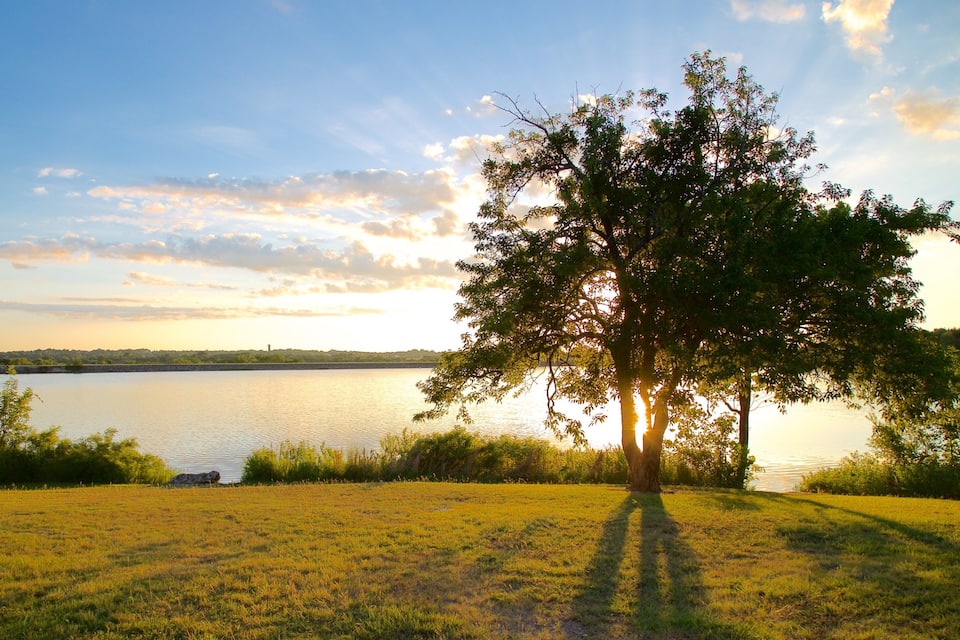 A lake with trees and a clear sky.