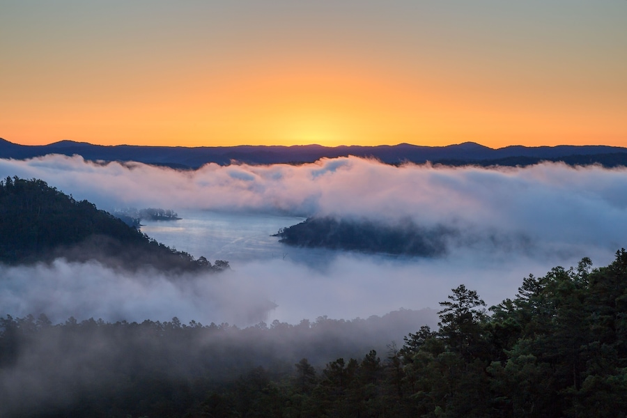The sun rises on a foggy morning at Broken Bow Lake in Oklahoma, USA., Shutterstock ID 660031147, purchase_order: SP-1269 HA 2018 Batch 1, Order: , client: , other: