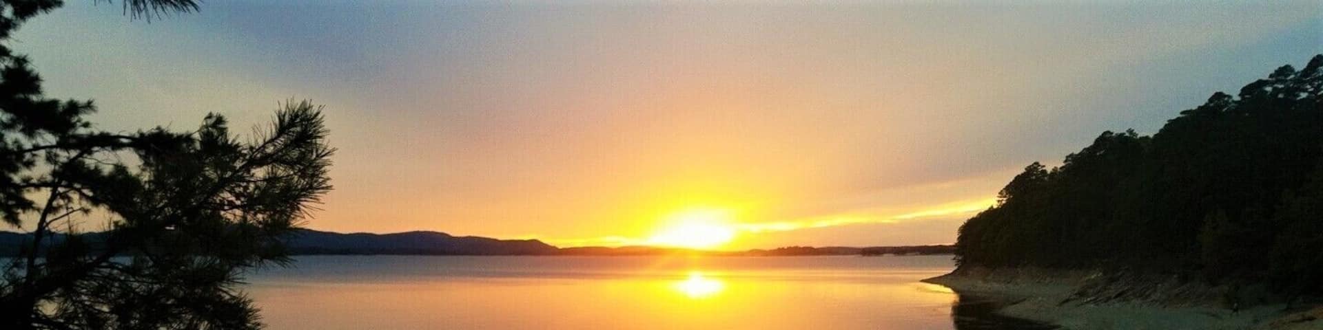Camped out for the weekend on Hotel Island on Lake Ouachita (there is no hotel on the island :) It's just the largest of hundreds of islands on this lake). This was the view of our beach and first sunset on the lake. The water here was amazing and very clear as well, which made for great SCUBA diving conditions and the little bays around the islands provided calm water for wakeboarding and other watersports. #LifeAtExpedia #Nature #Trovember
