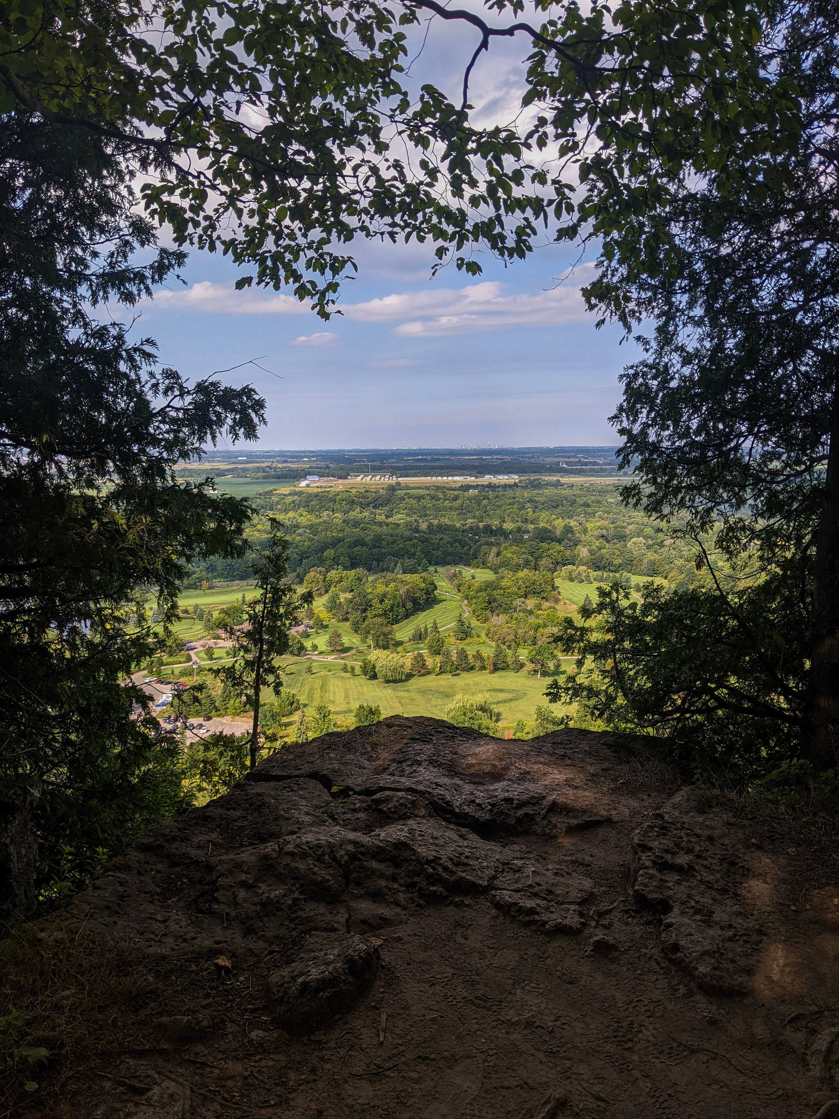 A view from the top of the Niagara Escarpment looking down at a golf course. At Kelso Park along the Bruce Trail in Milton, Ontario during the summer