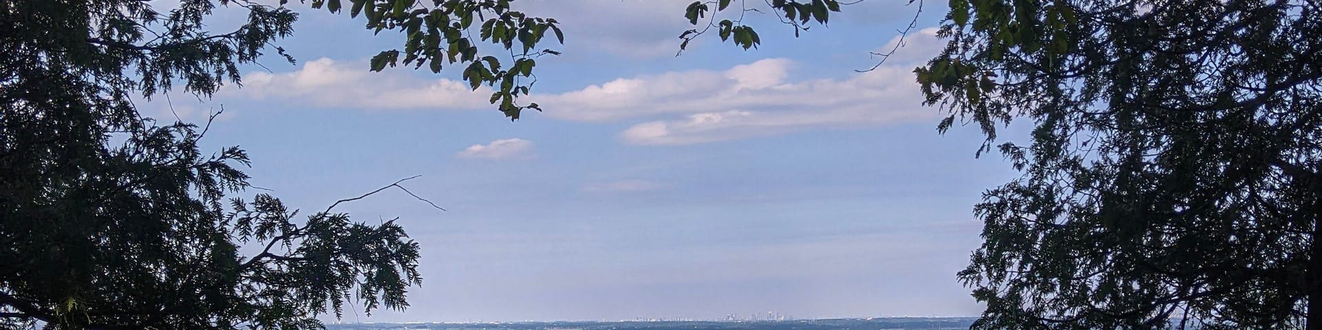 A view from the top of the Niagara Escarpment looking down at a golf course. At Kelso Park along the Bruce Trail in Milton, Ontario during the summer